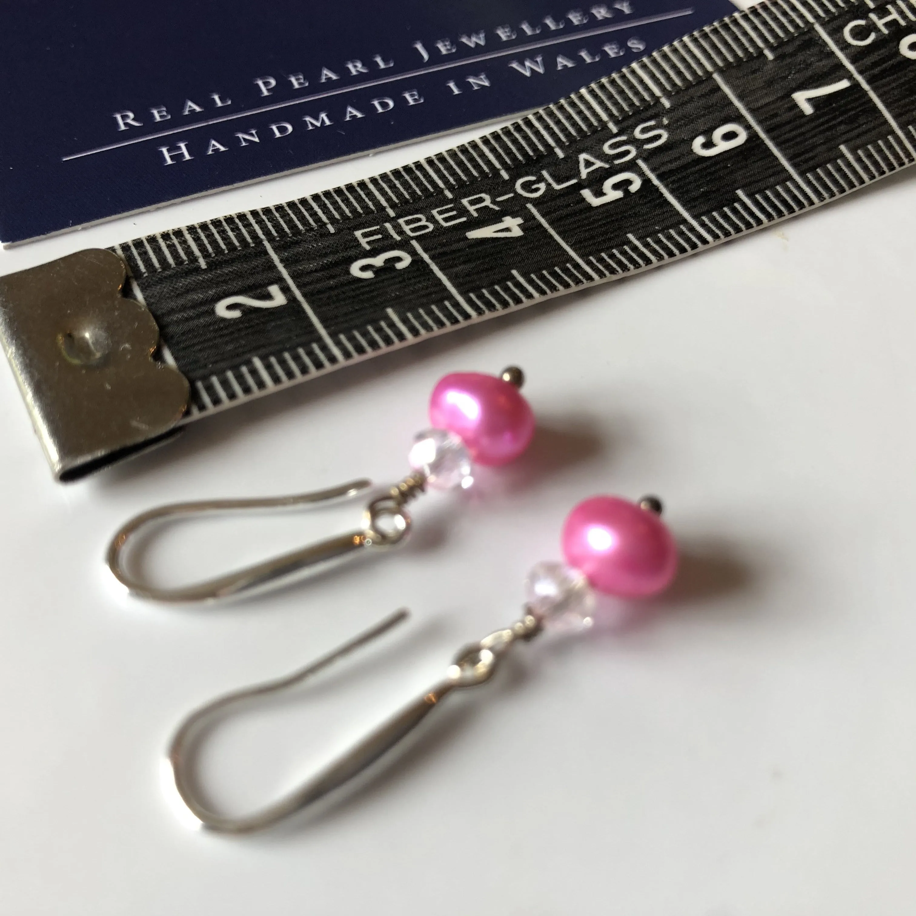 Earrings: Single pink pearl drop earrings