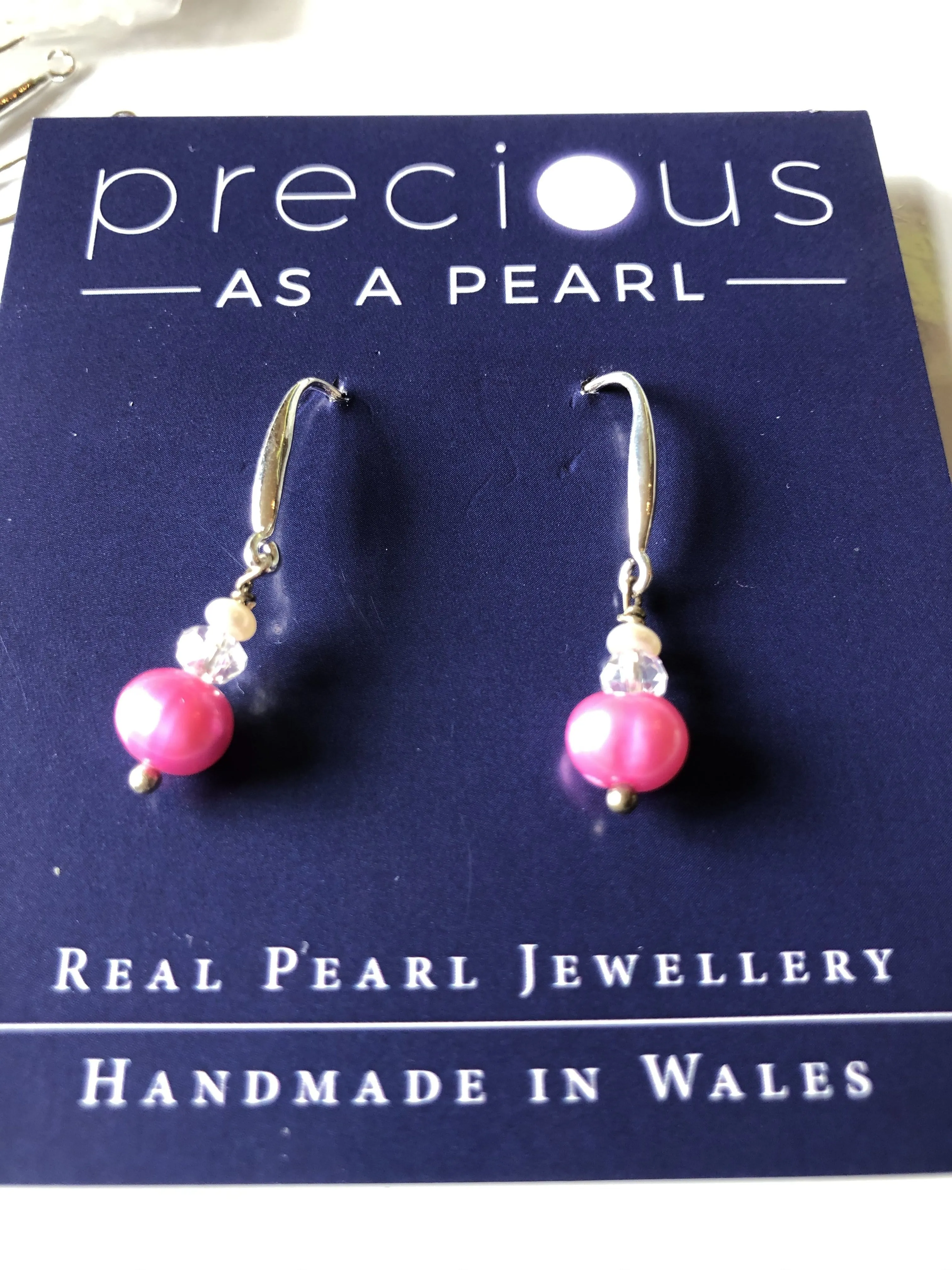 Earrings: Single pink pearl drop earrings