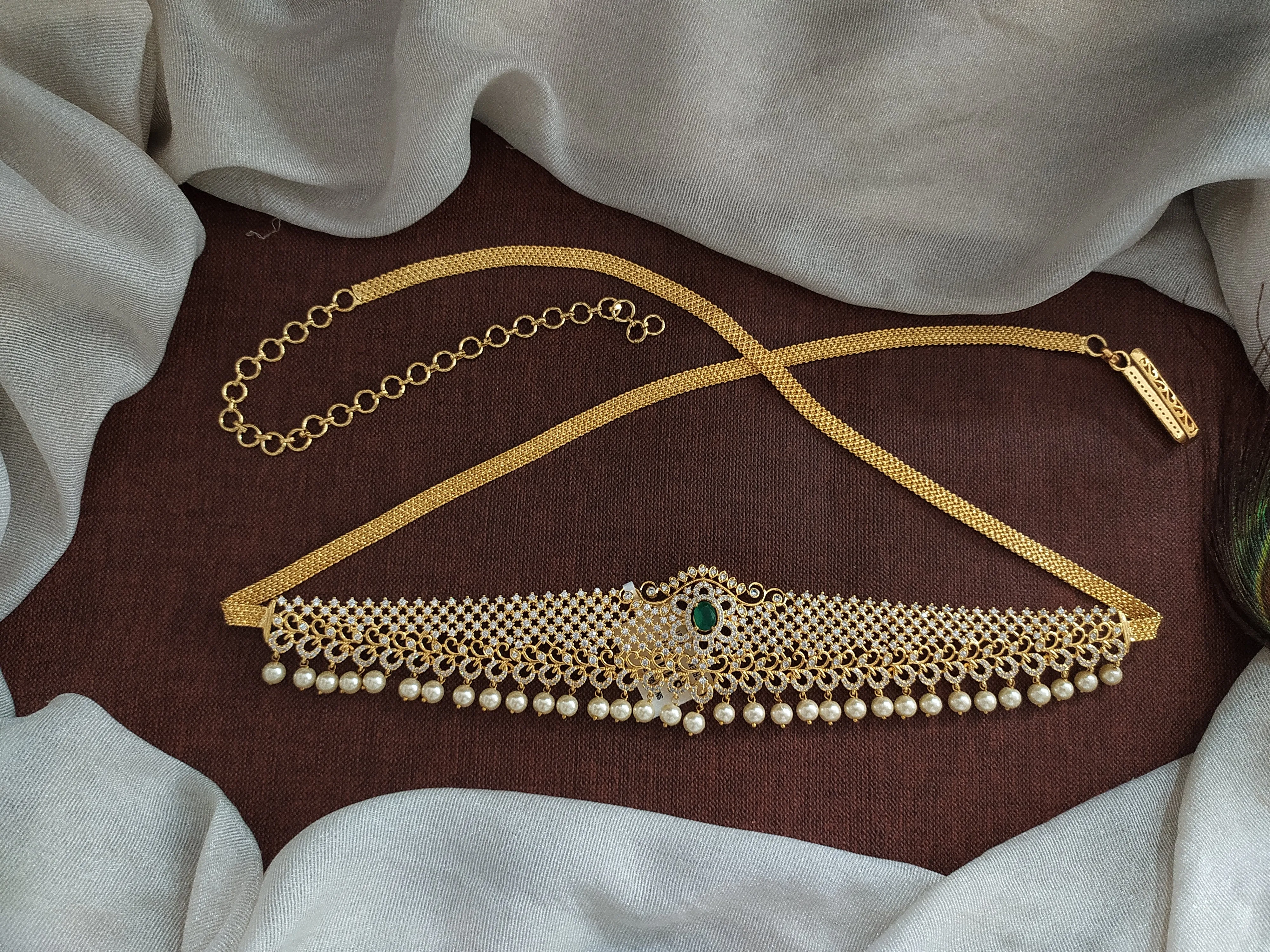 Embrace Duality With Gold-Plated Zircon Hip Chain with Ruby & Green Elegance