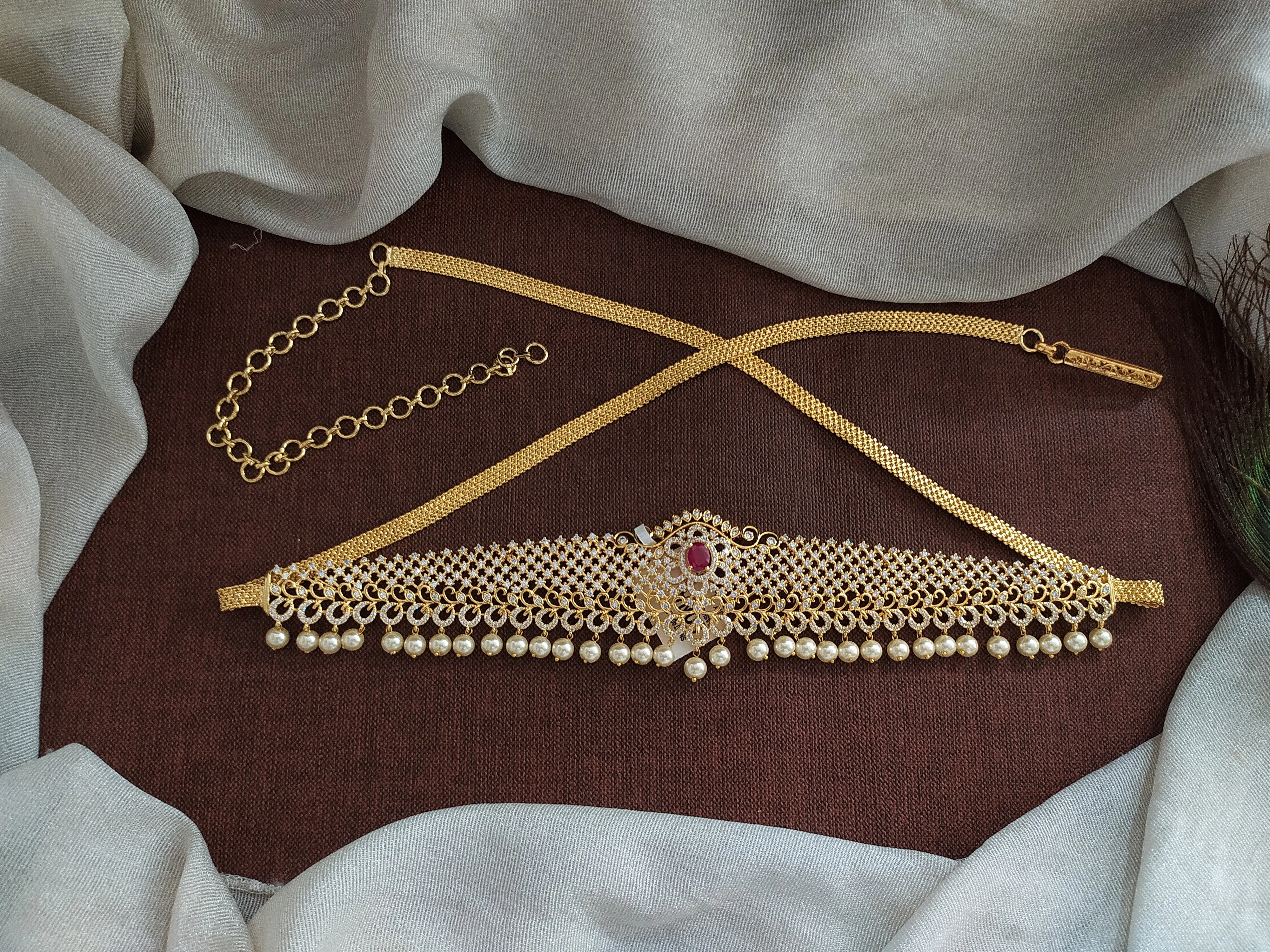 Embrace Duality With Gold-Plated Zircon Hip Chain with Ruby & Green Elegance