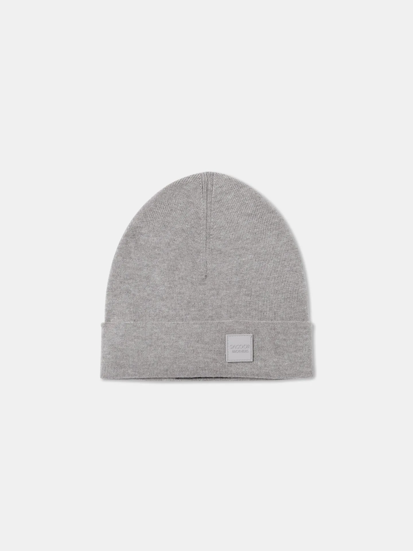 Knitted beanie with silicone badge