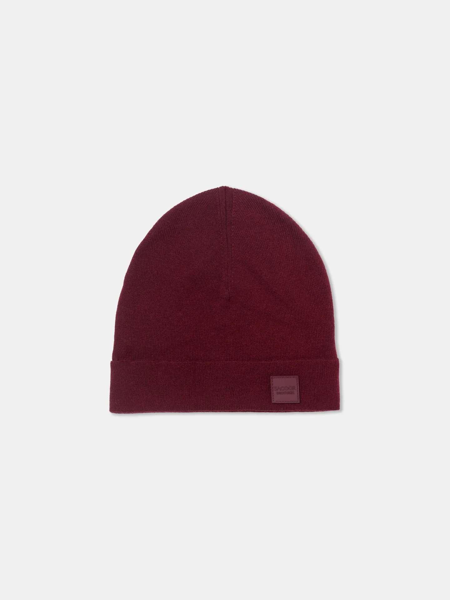 Knitted beanie with silicone badge
